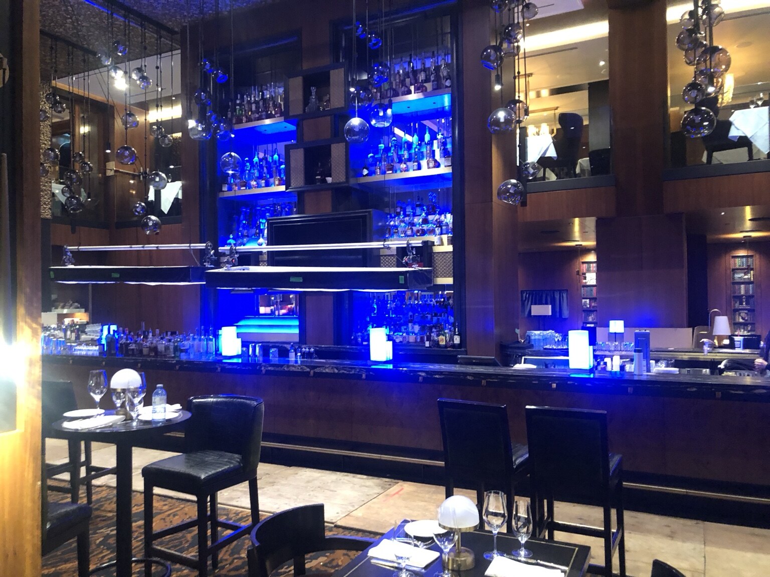 Bar set illuminated with blue accent lighting